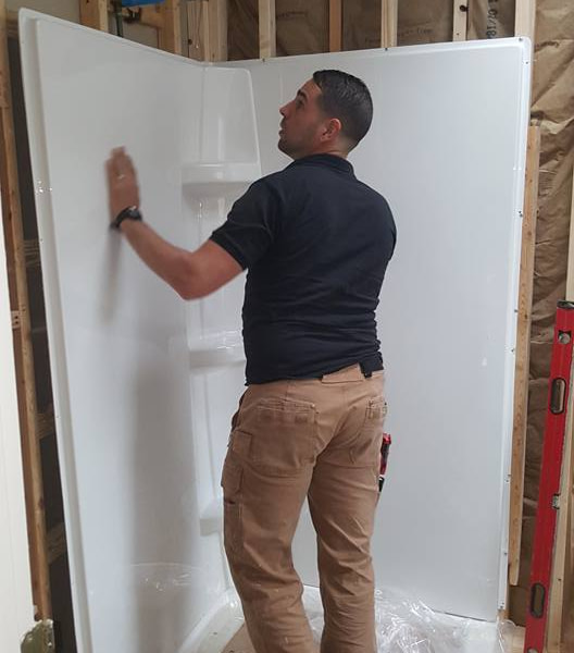 avanti worker installing shower